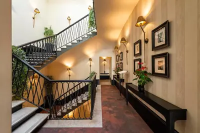 a hallway with stairs in a building at Profumo Maison Colosseo in Rome