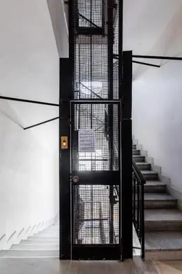 an open door in a room with stairs at Crosti Apartments in Rome