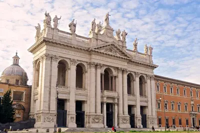 a large building with statues on the top of it at Tata B&B in Rome