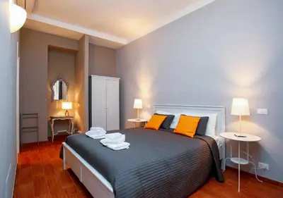 a bedroom with a bed with two towels on it at Clemy In Rome in Rome
