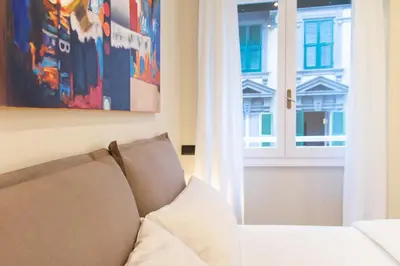 a living room with a couch and a window at Prati 25.7 Suites in Rome in Rome