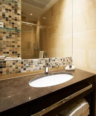 a bathroom with a sink and a large mirror at Harry's Bar Trevi Luxury Apartments - Mignanelli in Rome