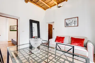 a living room with a white couch and a glass table at LIVING COLOSSEUM in Rome