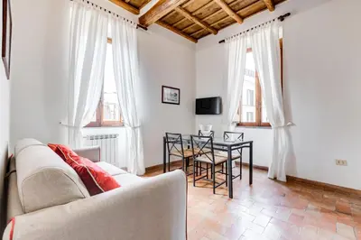 a living room with a couch and a table at LIVING COLOSSEUM in Rome