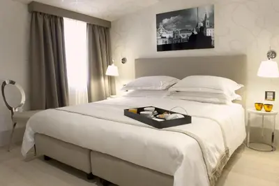 a bedroom with a large bed with a tray on it at Mood44 in Rome