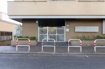 two barricades on a street in front of a building at Giulio Cesare Apartment in Rome
