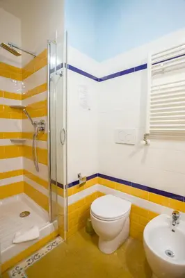 a bathroom with a toilet and a shower and a sink at Anthony 47 in Rome