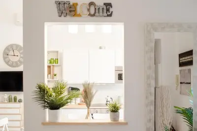 a kitchen with a sink and a window at White Fanti Apartment in Rome