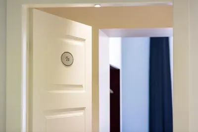 an open door with a clock on it at Residenza Alexander Guest House in Rome