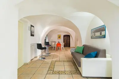 a living room with a couch and a table at Moro 50 - Loft in Trastevere in Rome