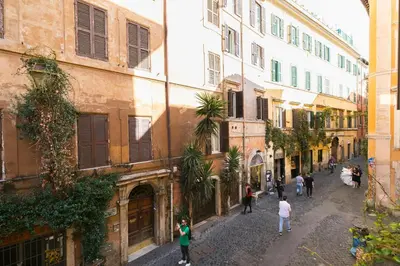 a group of people walking down a street at Moro 50 - Loft in Trastevere in Rome