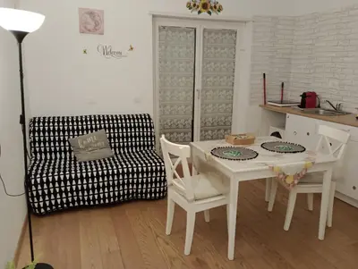 a living room with a table and chairs and a couch at LIVING ROME Int 2 in Rome