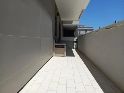 an empty hallway of a building with a white tile floor at LIVING ROME Int 2 in Rome