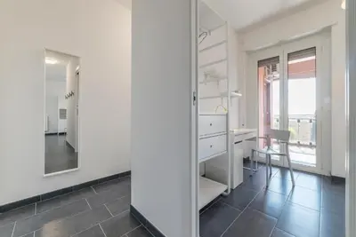 a white bathroom with a desk and a mirror at Charming Apartment in Rome + Internet in Rome