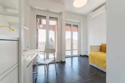 a bedroom with a bed and a desk and a table at Charming Apartment in Rome + Internet in Rome