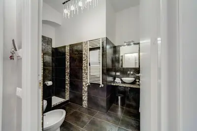 a bathroom with a toilet and a sink at B&B Colosseo Panoramic Rooms in Rome