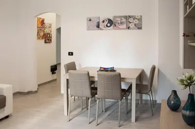 a dining room with a table and chairs at Mimma's House Private Garden near Trastevere in Rome