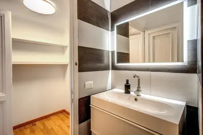 a bathroom with a sink and a mirror at Diocleziano Triple in Rome
