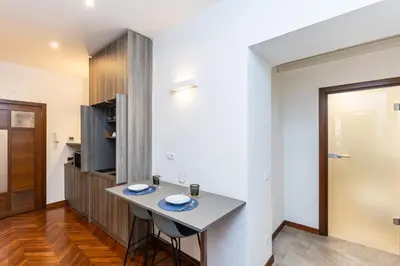 a kitchen with a table in a room at TIME in Rome