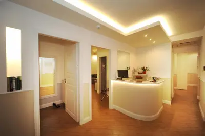 a room with a desk with a computer on it at My Suites Piazza di Spagna in Rome