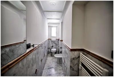 a bathroom with a toilet and a sink at Accogliente appartamento a Testaccio in Rome