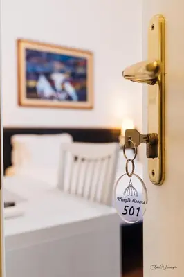 a keychain hanging from a door in a bedroom at Magik rooms in Rome