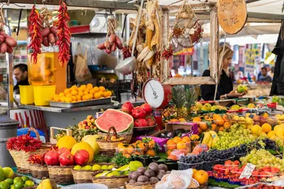a market with lots of fruits and vegetables on display at Giubbonari Suites in Rome