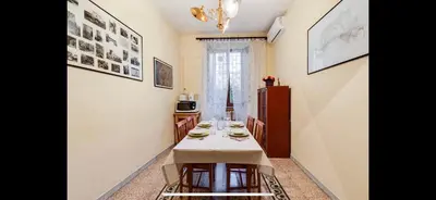 a kitchen with a table with plates on it at Center Rome Coliseum in Rome