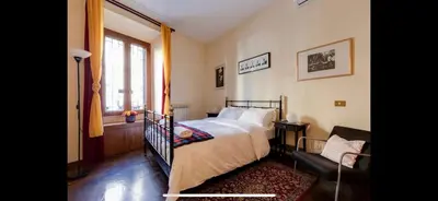 a bedroom with a bed and a window at Center Rome Coliseum in Rome