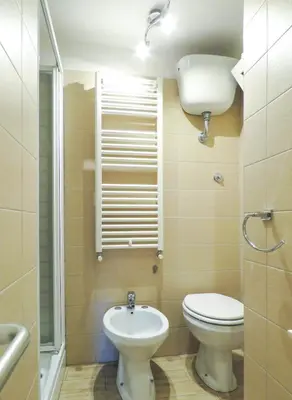a bathroom with a toilet and a sink at Casa Sofia - beauty apartment close Vatican Museum in Rome