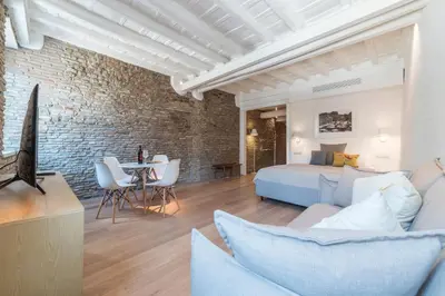 a bedroom with a bed and a living room at Campo De' Fiori Apartment - Charme Holidays in Rome