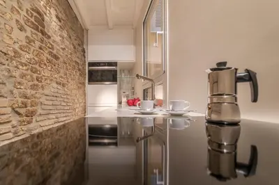 a kitchen with a coffee machine sitting on a counter at Campo De' Fiori Apartment - Charme Holidays in Rome