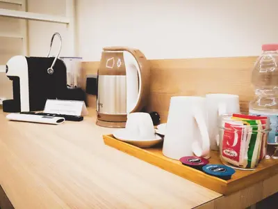 a counter top with a coffee maker and a coffee maker at My Maison 109 Guest House in Rome