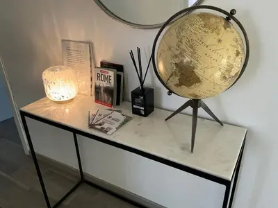 a table with a globe and a lamp on it at Enjoy Vatican in Rome