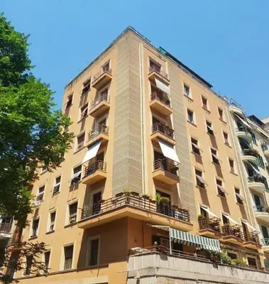 a tall building with balconies on the side of it at Casa Via Cesena in Rome