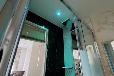 a bathroom with a shower with a glass door at Relais Aquarium in Rome