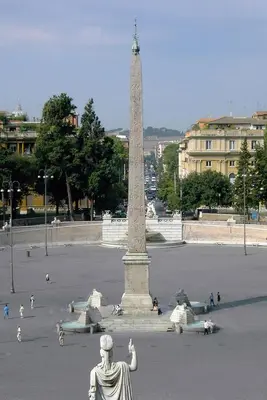 a statue in front of a monument in a square at Rifugio degli Artisti B&B in Rome