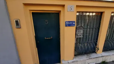 a blue door on the side of a building at B&B Five in Rome