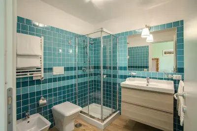 a bathroom with a sink and a shower and a toilet at Residenza Dei Principi in Rome