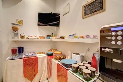 a kitchen with a counter with food on it at Residenza Dei Principi in Rome