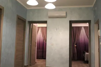 two doors in a room with purple curtains at Iris Guest House in Rome