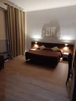 a bedroom with a bed with lights on it at Leone in Rome