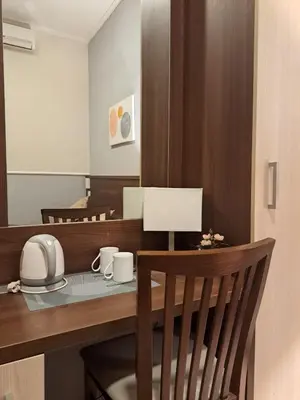 a kitchen with a table with cups and a mirror at Leone in Rome