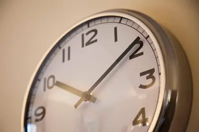 a clock that is on a wall at Monti house in Rome