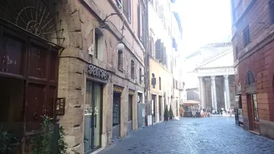 an empty street in a city with buildings at Al Pantheon Con Thomas Mann in Rome
