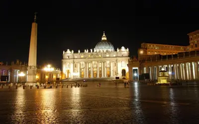 a bedroom with a large bed and a couch at 285 Vatican Lodge in Rome