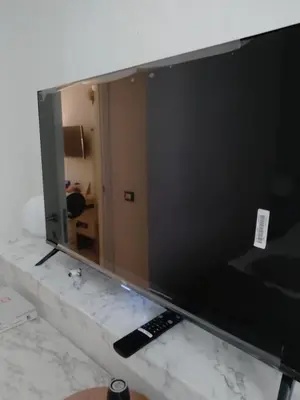 a white bathroom with a toilet and a roll of toilet paper at 285 Vatican Lodge in Rome