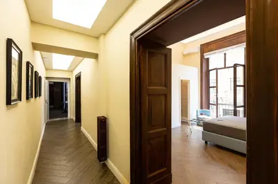 a hallway with a door leading to a bedroom at SPA Apartment Via Barberini in Rome