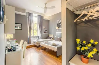 a living room with a couch and a table at AmoRoma Suite in Rome