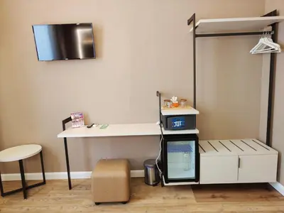 a room with a desk and a table and a chair at AmoRoma Suite in Rome